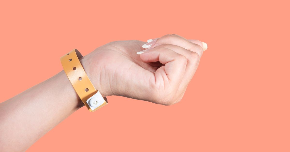 Close-up of a plastic event wristband with a snap closure