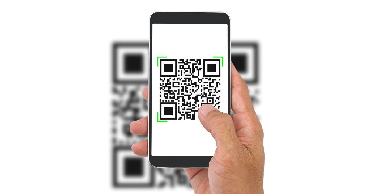 Smartphone scanning a QR code on screen