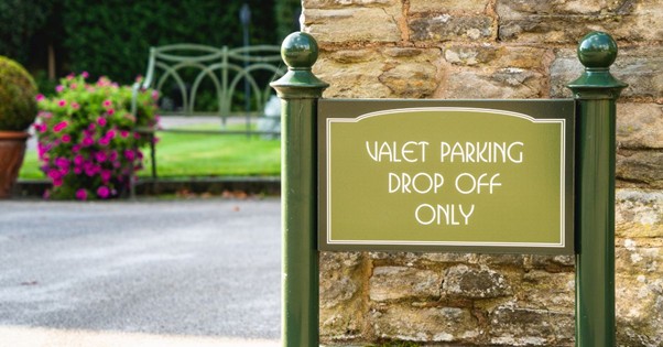 Valet parking drop-off sign at a venue entrance